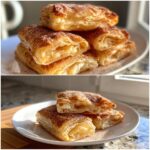 A stack of flaky desserts with puff pastry sheets, dusted with cinnamon sugar, on a white plate.
